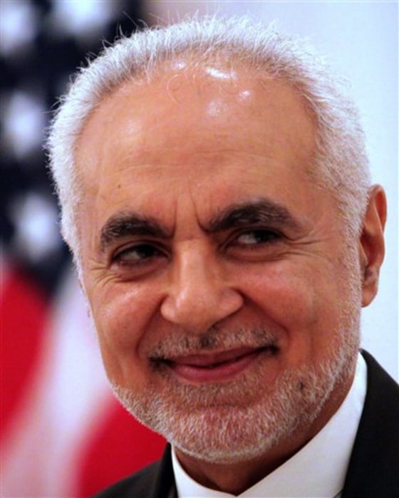 Imam Feisal Abdul Rauf smiles with guests at an iftar dinner Sunday,hosted by the U.S. Embassy's deputy chief of mission Stephanie Williams, unseen, at the U.S. ambassador's residence in Saar, Bahrain, west of the capital Manama. Rauf, the imam leading plans for an Islamic center near the site of the Sept. 11 attacks on New York, spoke as other guests broke their daylong Ramadan fast with dates and water.